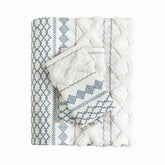 Textile with blue geometric patterns on a white background