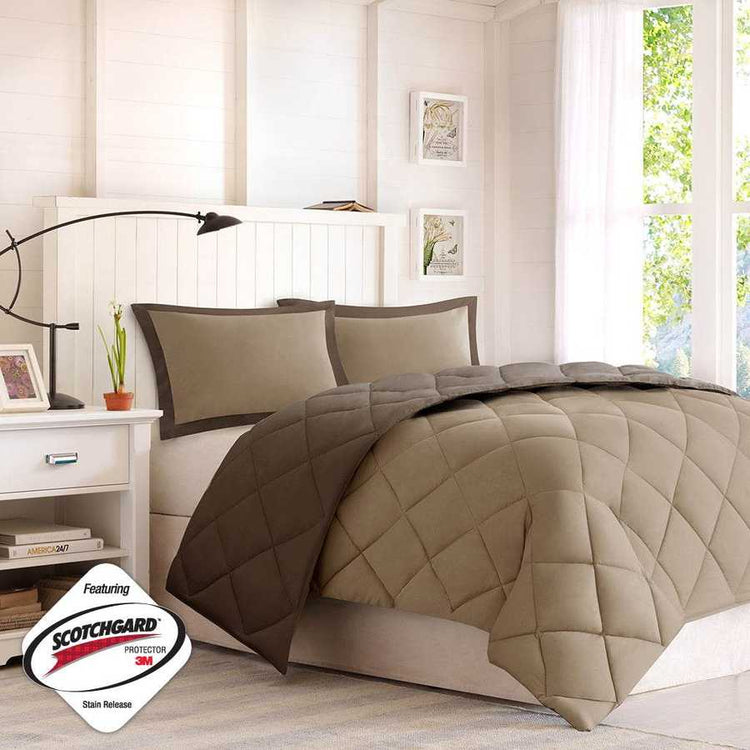 Beige quilt and pillow set on a bed in a bedroom with &