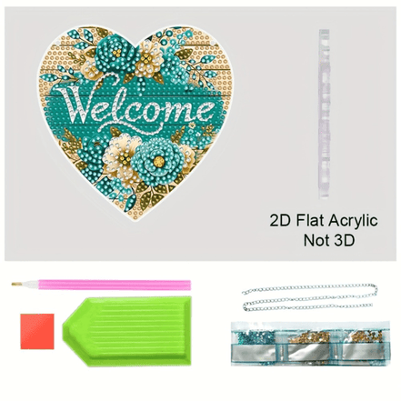 Close-up of heart-shaped acrylic sun catcher with crafting tools