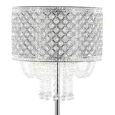 A silver table lamp with a cylindrical shade covered in clear faceted crystal tiles in a diamond pattern, with hanging crystal bead strands below, shown on a white background.
