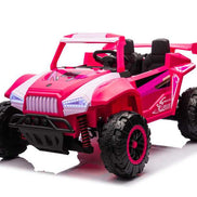 Pink electric ride-on vehicle with large off-road tires