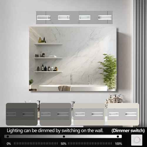 A wall-mounted bathroom mirror with integrated LED lighting and a dimmer switch control shown below. The mirror reflects a modern white marble-look vanity with shelves and a plant.