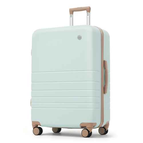 A hard-shell spinner suitcase in a pale mint green color with light brown accents on the telescoping handle, side handle, zipper trim, and wheel caps, shown on a plain white background.