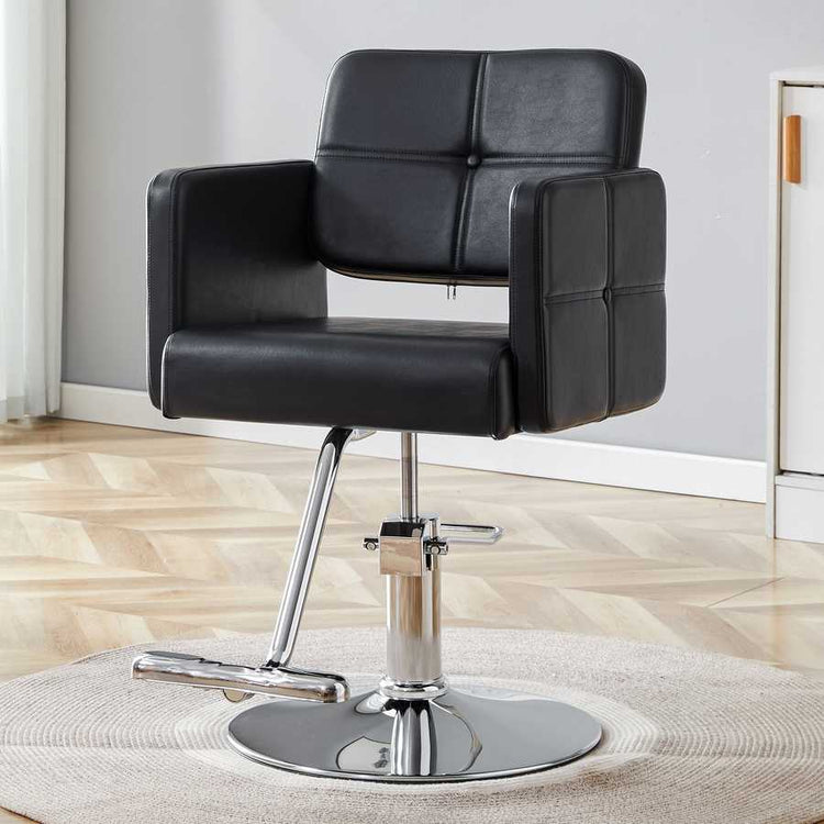Close-up of black salon chair with chrome base