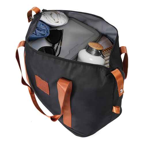 Open black travel bag filled with clothes, accessories, and toiletries, showing spacious interior for packing
