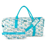 Floral duffel bag with blue straps on a white background