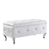 White tufted storage bench with decorative buttons on a white background