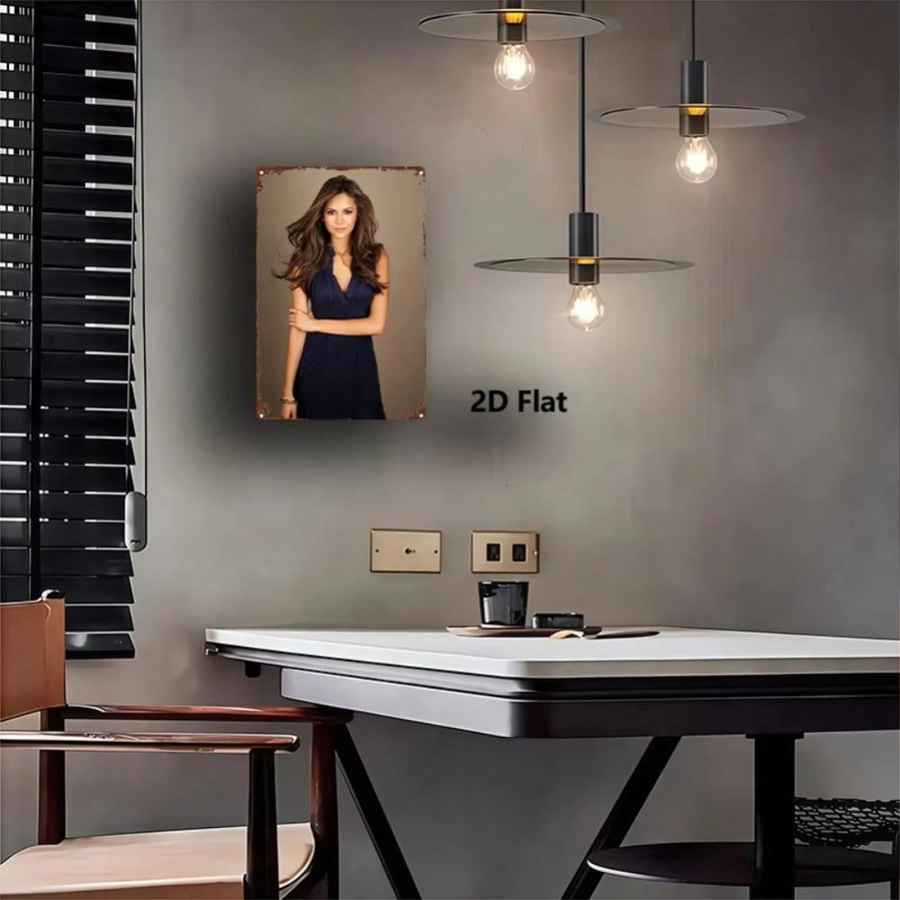 A framed portrait print of a woman in a navy dress displayed on a gray wall above a white table in a modern room. The print has a rustic distressed border and the text &
