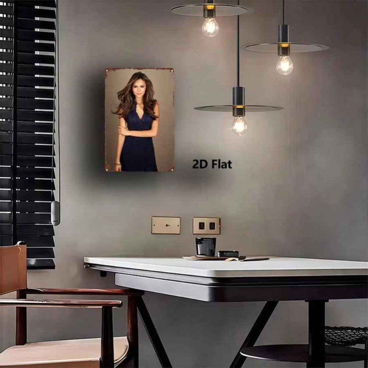 A framed portrait print of a woman in a navy dress displayed on a gray wall above a white table in a modern room. The print has a rustic distressed border and the text &