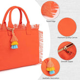 Orange tote bag with tassel edge, premium quality canvas, smooth zipper, and aesthetic decoration on a white background.