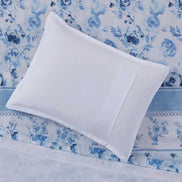 White pillow sham on top of the Twin Floral Striped Duvet Cover Set - Twin Duvet Cover Set Floral, highlighting the floral and stripe detailing.
