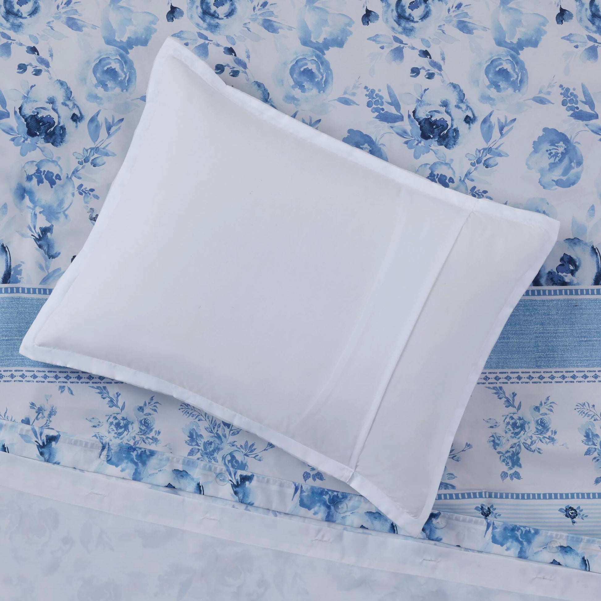 White pillow sham on top of the Twin Floral Striped Duvet Cover Set - Twin Duvet Cover Set Floral, highlighting the floral and stripe detailing.