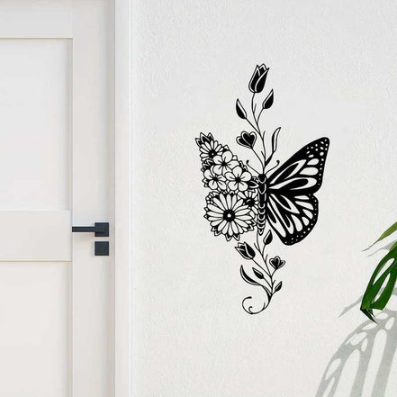 Aluminum butterfly wall art with floral accents mounted near a white door, adding rustic charm to entryway decor.