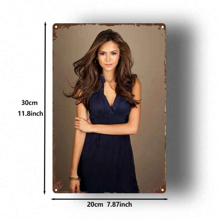 A vertical rectangular wall art print or tin sign featuring a portrait of a woman in a dark navy dress against a taupe background, with rust-style distressed corners. Black measurement lines and text indicate dimensions: 30cm / 11.