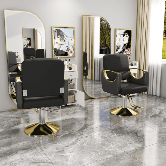 Black and gold modern salon chair with mirror and marble floor