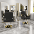 Black and gold modern salon chair with mirror and marble floor