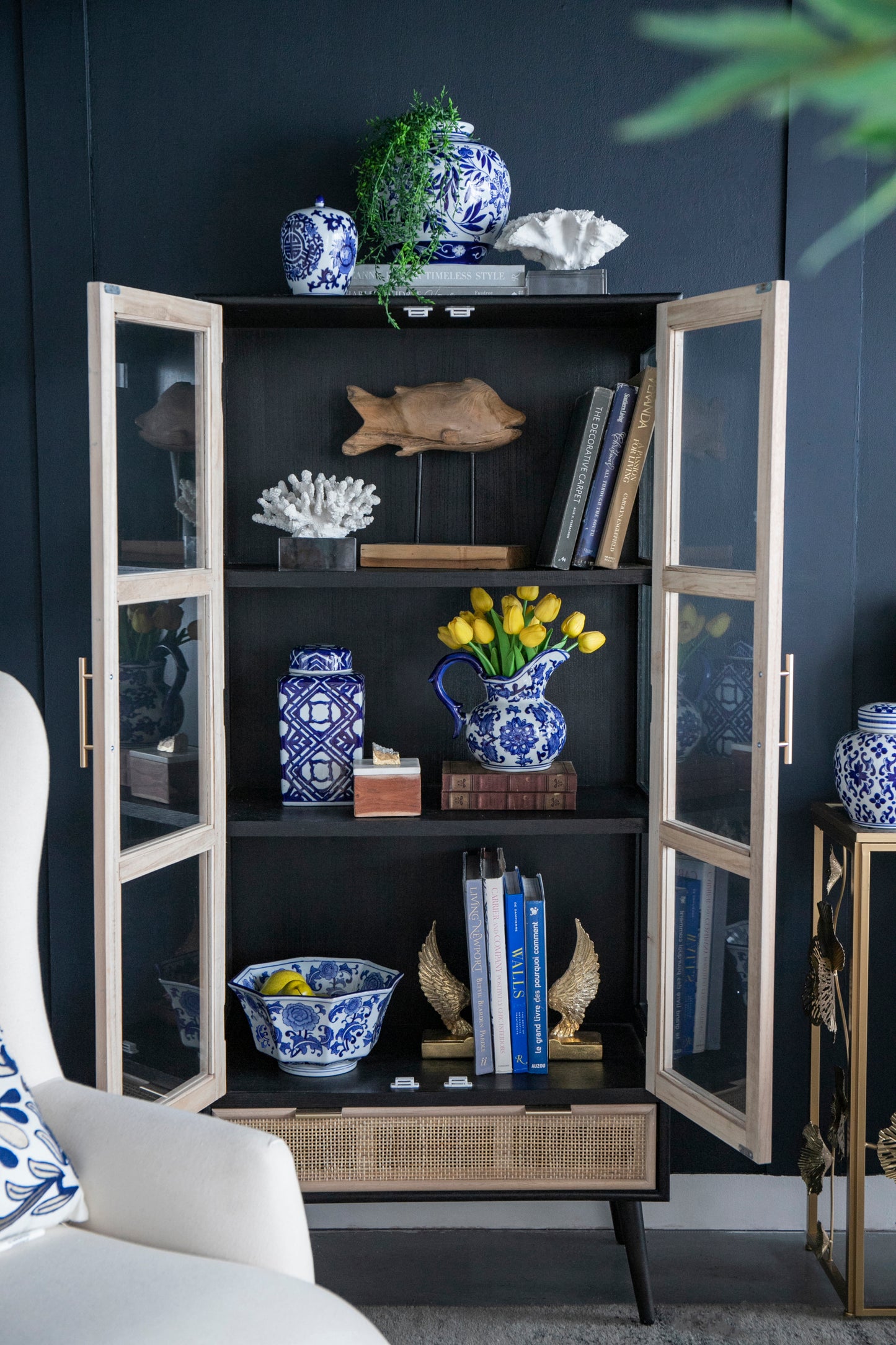 Blue and White Decorative Bowl - Porcelain, Elegant Design placed in a display cabinet with matching blue and white ceramics.