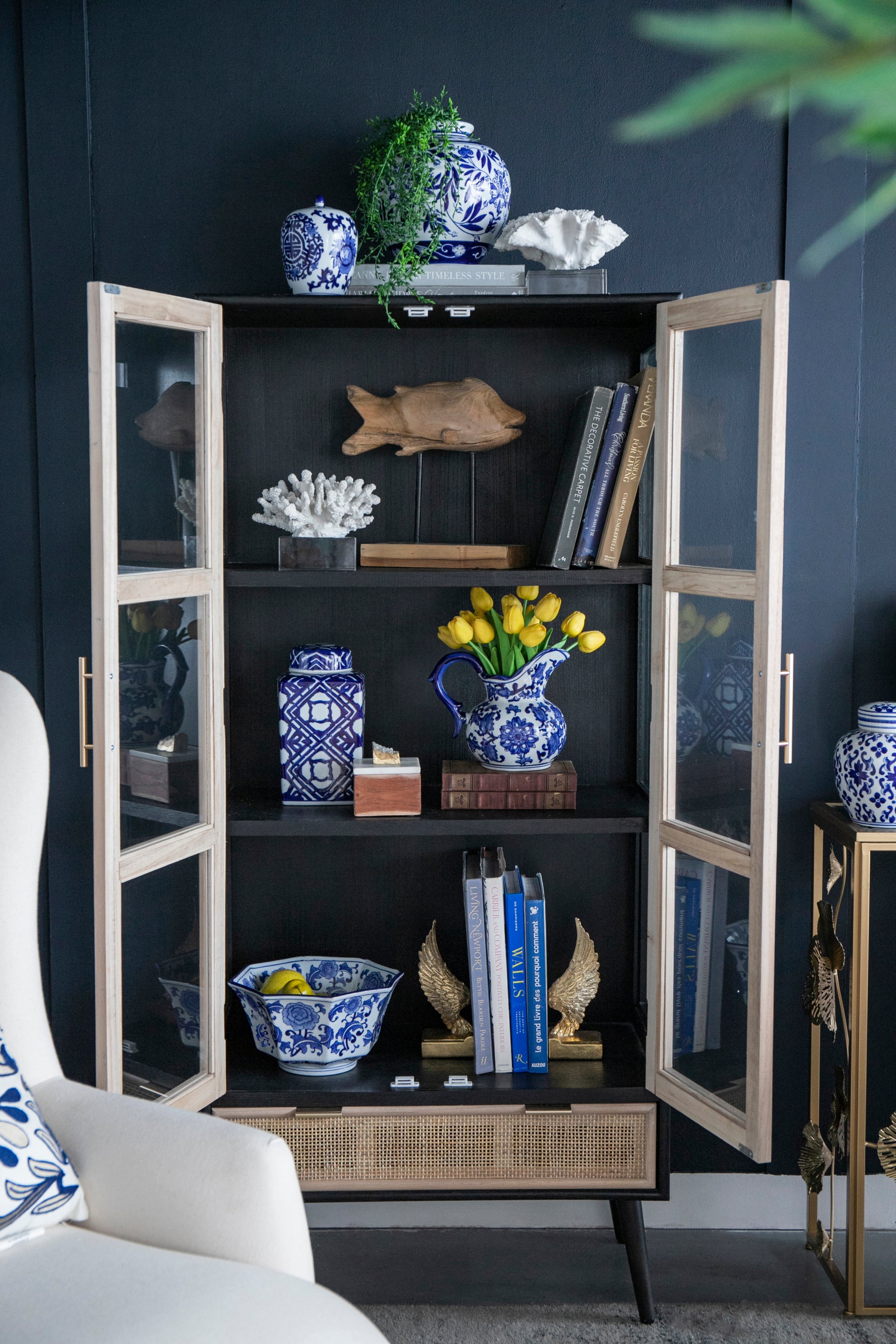 Blue and White Decorative Bowl - Porcelain, Elegant Design placed in a display cabinet with matching blue and white ceramics.