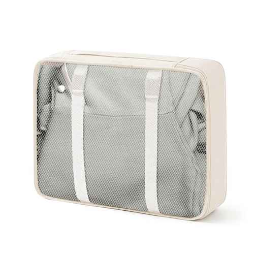Cream-colored travel packing cube with mesh top and adjustable straps, designed for organizing clothes inside luggage
