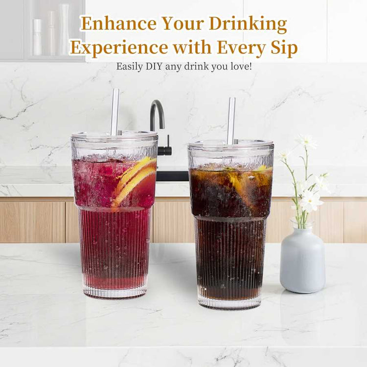 Glass water cups with straws in a kitchen setting for drinks like water, coffee, and smoothies