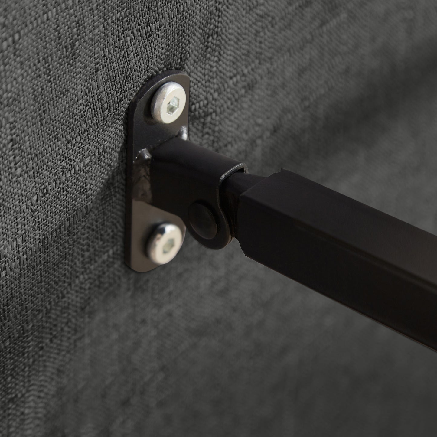 Close-up of metal hinge and screws on the Convertible Sofa Bed Chair, emphasizing sturdy construction and foldable design.