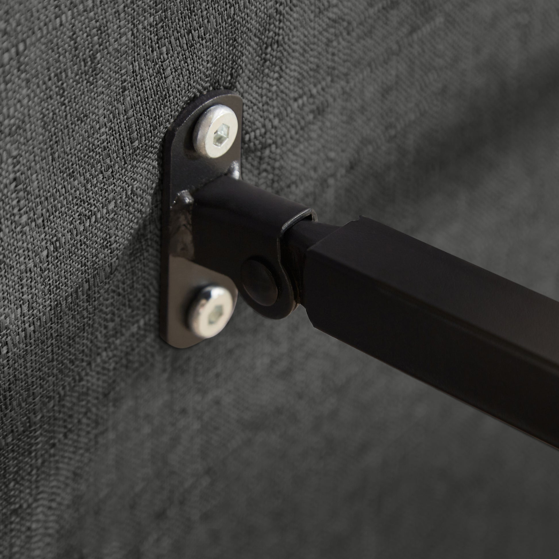Close-up of metal hinge and screws on the Convertible Sofa Bed Chair, emphasizing sturdy construction and foldable design.