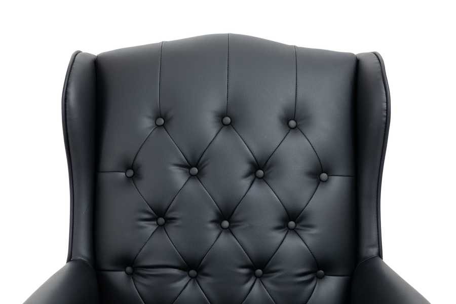 Black leather armchair with tufted backrest on a white background
