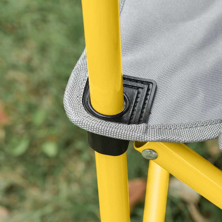 Close-up of a yellow metal frame with gray fabric and black fastener against a blurred natural background