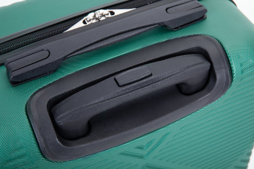 Close-up of a green hard-shell suitcase showing the telescoping handle, black plastic handle surround, zipper pull, and textured exterior surface.