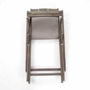 Wooden chair with a gray cushion on a white background