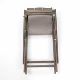 Wooden chair with a gray cushion on a white background