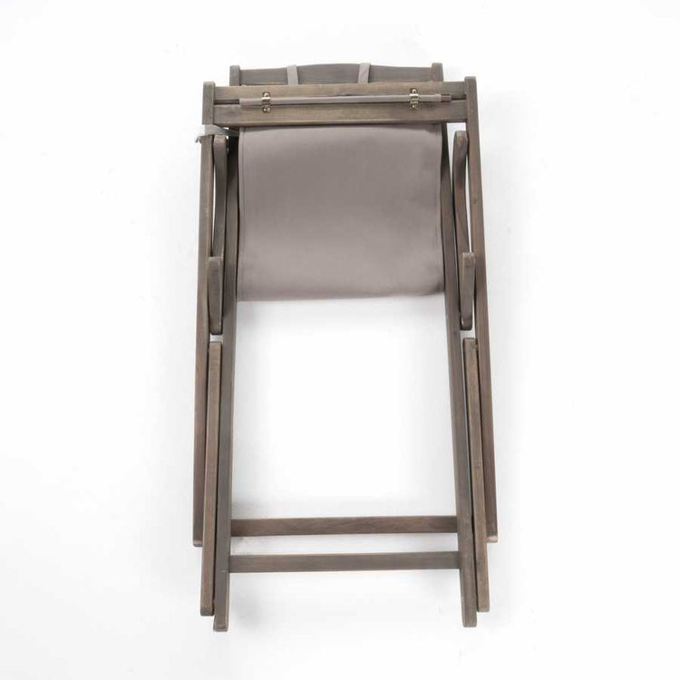 Wooden chair with a gray cushion on a white background