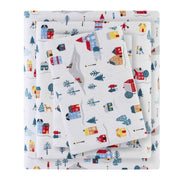 Folded 3 PCS Twin XL Printed Sheet Set with White Village Print, highlighting soft cotton flannel texture and playful winter village design.