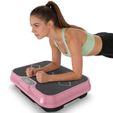 Woman using a pink vibration plate on a white background