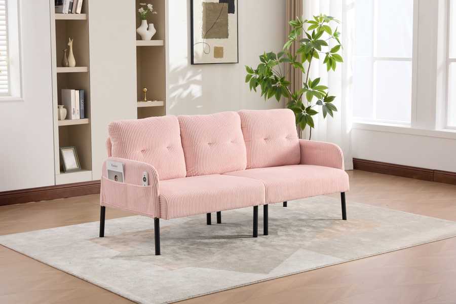 Pink sofa in a living room with shelves and plants