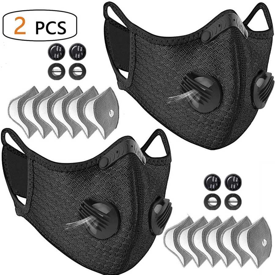 Two black face masks with valve and filter included on a white background