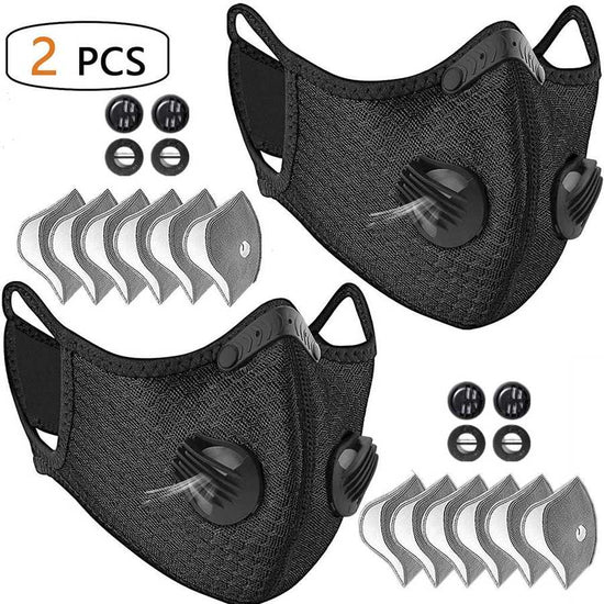 Two black face masks with valve and filter included on a white background