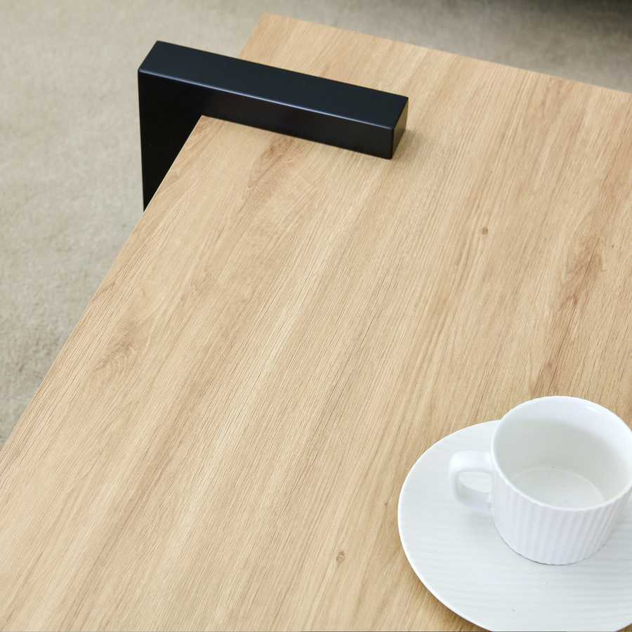Close-up of MDF Coffee Table corner showing wood grain texture and black leg detail, highlighting minimalist craftsmanship.