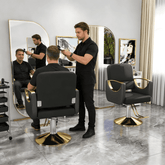 Barber salon chair with black upholstery and gold base
