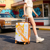 Person pulling a colorful suitcase with a retro car and graffiti in the background