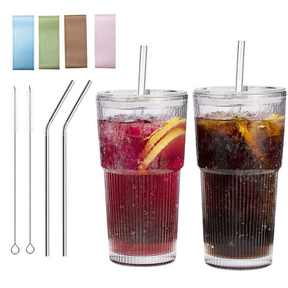 Set of colorful glass water cups with lids and straws for drinking