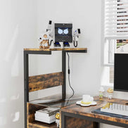Top shelf of computer desk with USB-powered charging station and decorative items, highlighting vertical storage and power access.