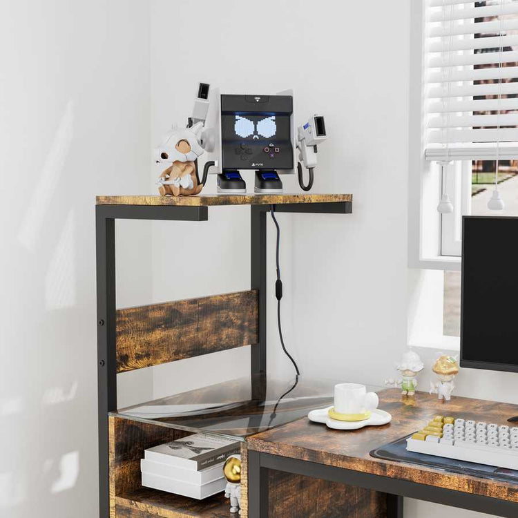 Top shelf of computer desk with USB-powered charging station and decorative items, highlighting vertical storage and power access.