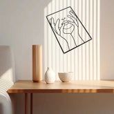 Single piece from 3Pcs Abstract Metal Wall Art set mounted diagonally above a wooden table, adding artistic flair to indoor spaces.