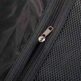 Black travel bag with durable zipper and mesh pocket, featuring a sturdy metal zipper pull for secure closure.