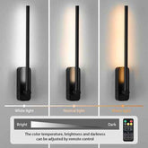Black wall lamp with adjustable light settings on a gray background