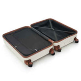 An open hard-shell suitcase in cream with brown trim and black interior lining, shown on a clean white background. The suitcase has four spinner wheels and a telescoping handle partially visible inside.