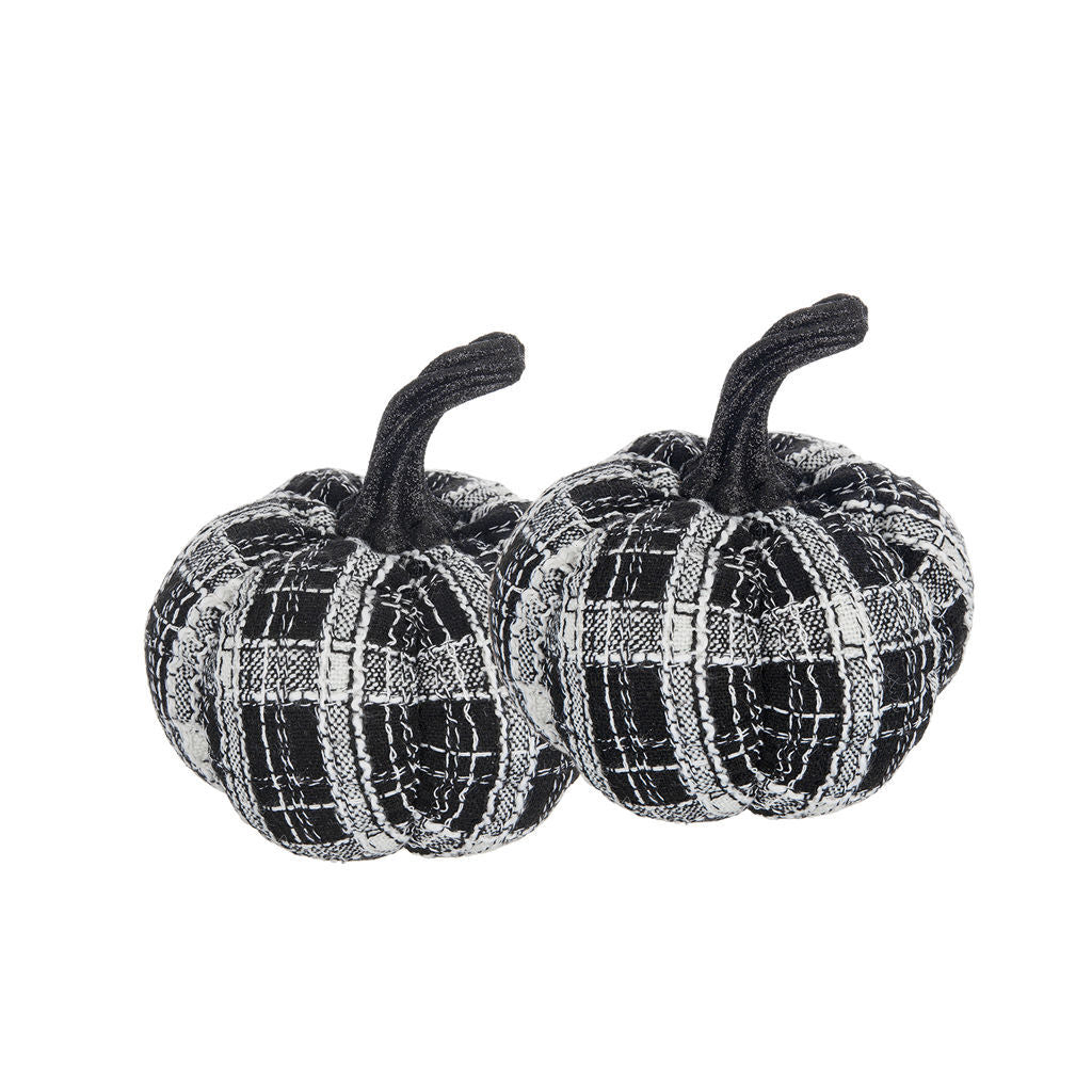 Two small decorative fabric pumpkins in a black and white plaid pattern with dark stems, shown on a plain white background.