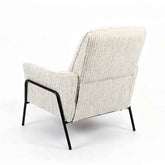 A modern upholstered armchair shown from the back, featuring textured cream and gray vertical striped fabric and a black metal frame on a white studio background.
