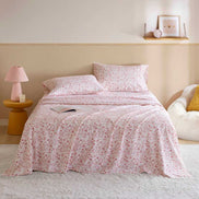 Holiday Doodles - Twin XL Cotton Flannel Sheet Set on a neatly made bed with festive red holiday prints, ideal for cozy dorm room decor.